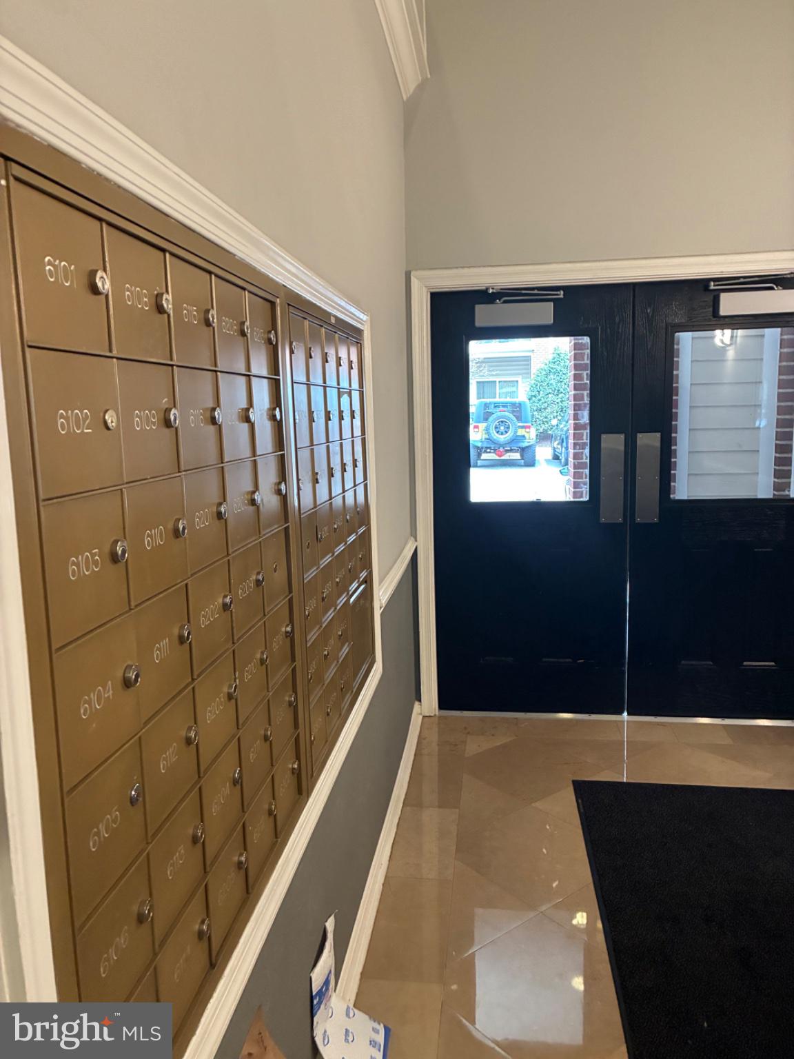 1571 Spring Gate Dr., Unit 6206 McLean, VA 22102 - Photo 8 of 26 Welcoming entry with secure mailboxes.