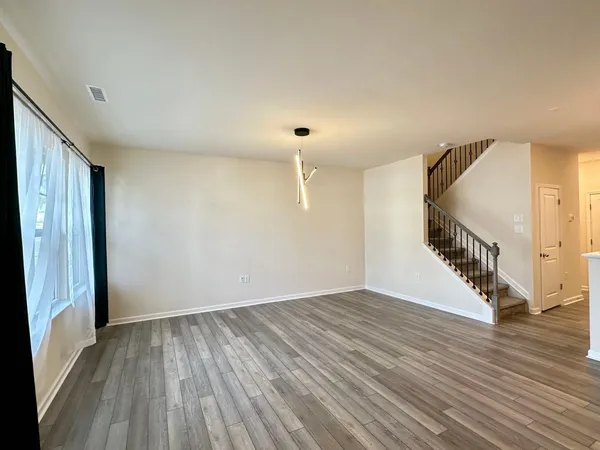a view of an entryway with wooden floor
