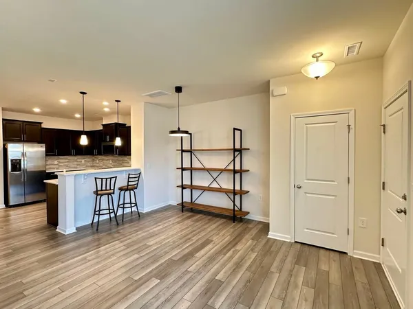 a view of a livingroom with furniture and wooden floor