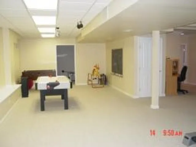 a bedroom with furniture and a chandelier
