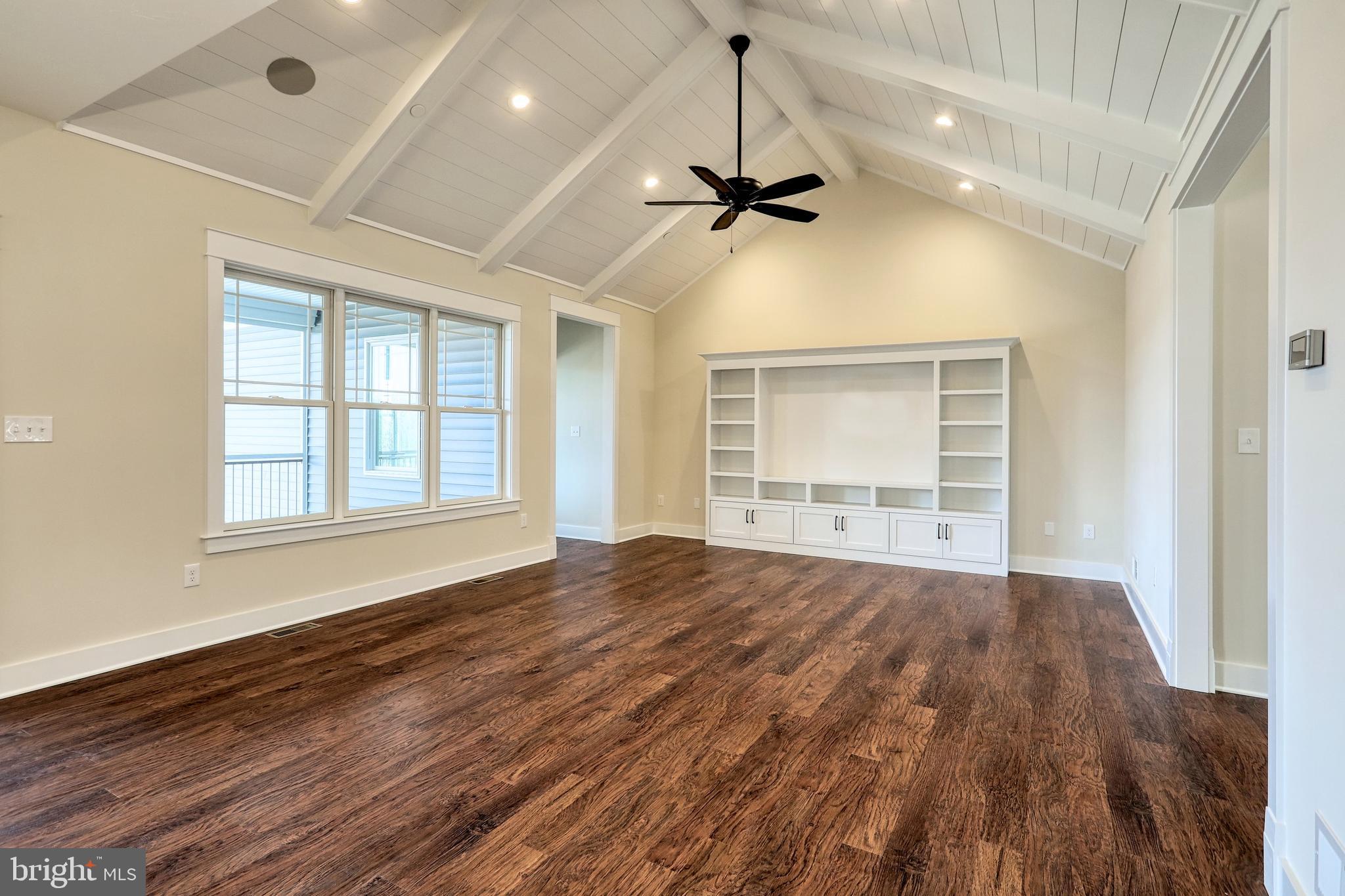 35 Warren Trail Fairfield, PA 17320 - Photo 23 of 67 a view of an empty room with a window and wooden floor