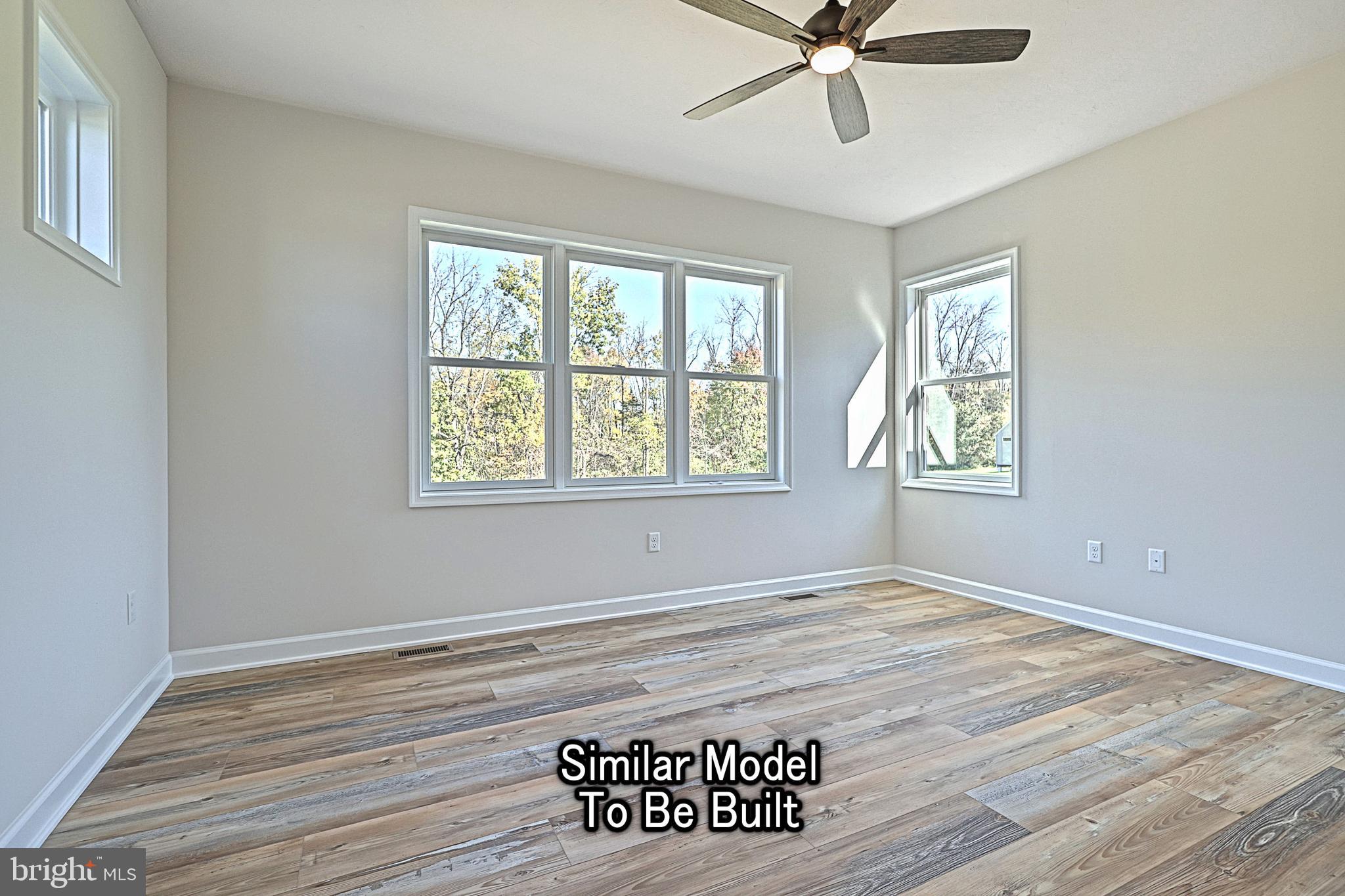 35 Warren Trail Fairfield, PA 17320 - Photo 44 of 67 a view of an empty room with window and wooden floor