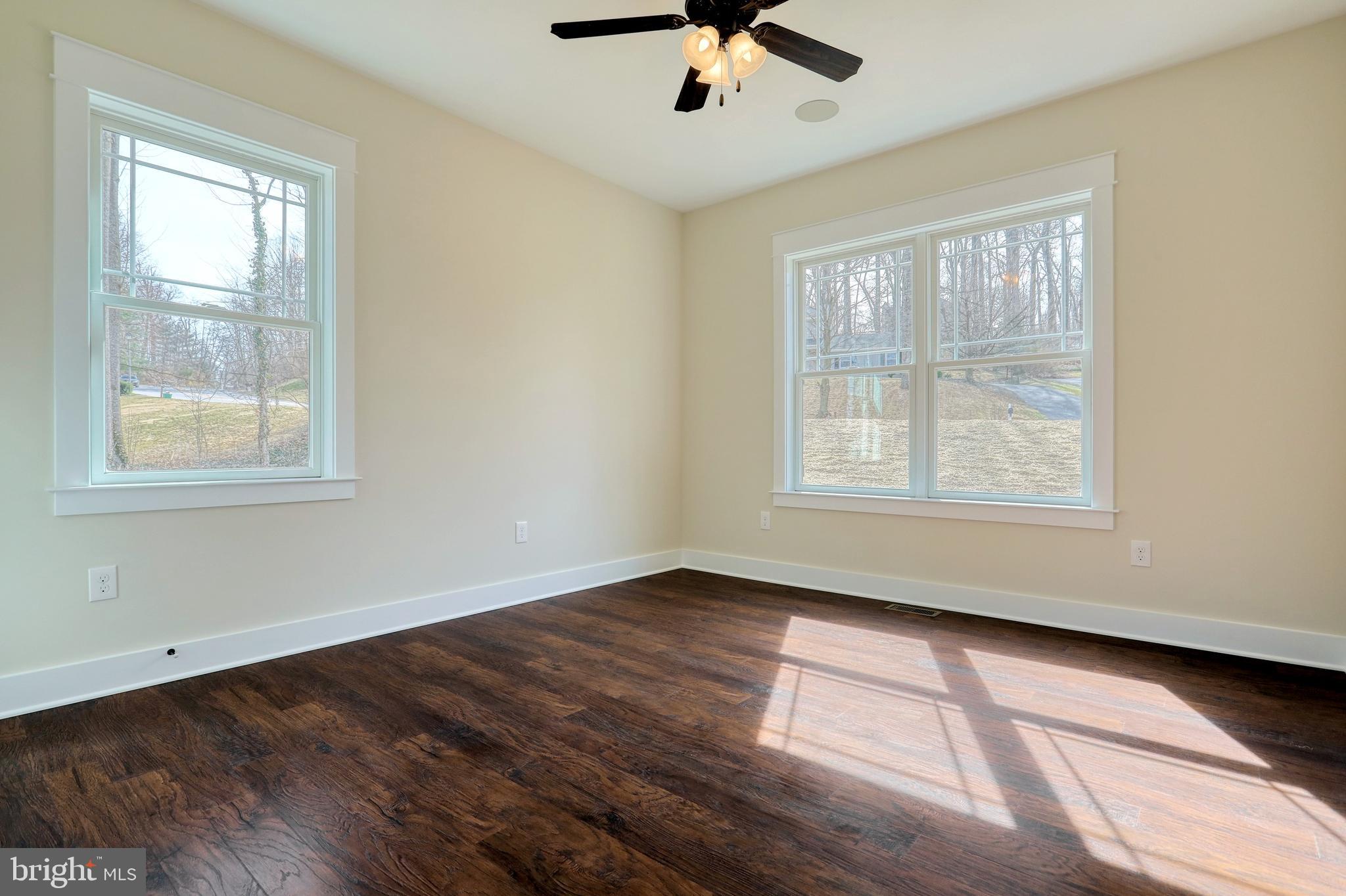 35 Warren Trail Fairfield, PA 17320 - Photo 54 of 67 a view of an empty room with a window and wooden floor