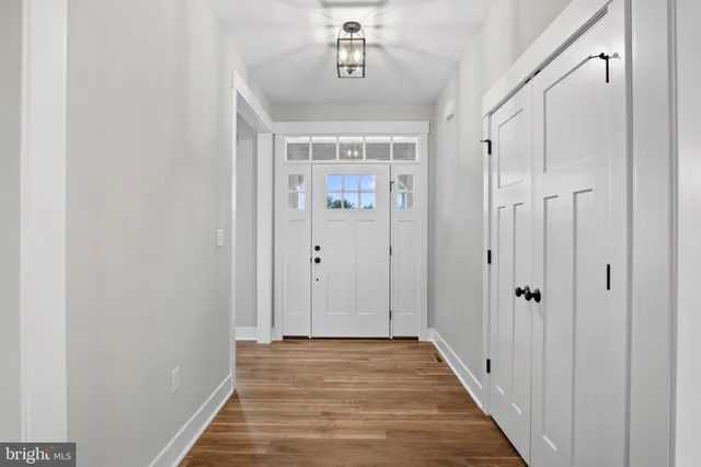 a kitchen with kitchen island a counter top space appliances and cabinets