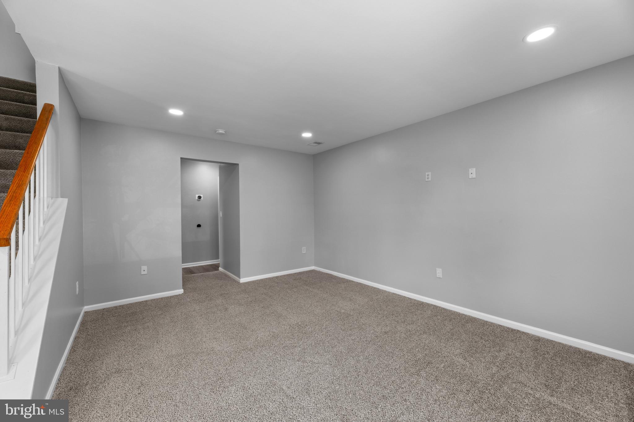 9302 Player Drive, Unit 155 Laurel, MD 20708 - Photo 5 of 43 an empty room with windows and entrance