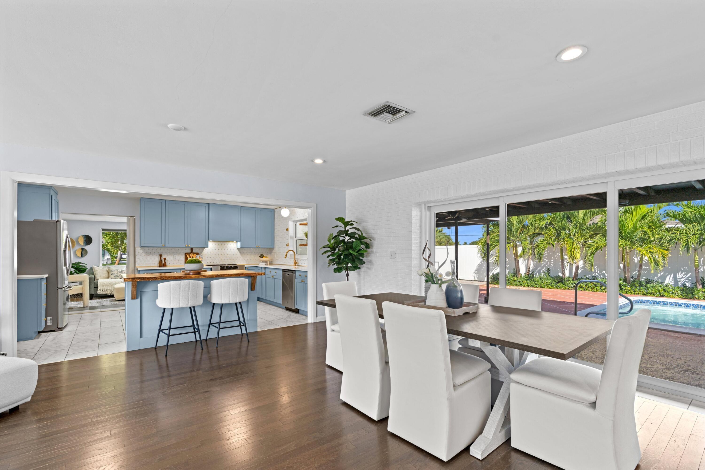 541 Kingfish Road North Palm Beach, FL 33408 - Photo 10 of 42 a view of a dining room with furniture window and wooden floor