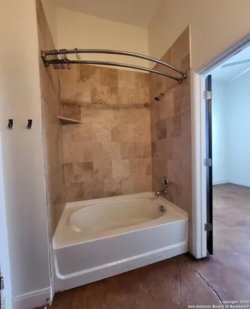 a bathroom with a toilet a sink and a mirror