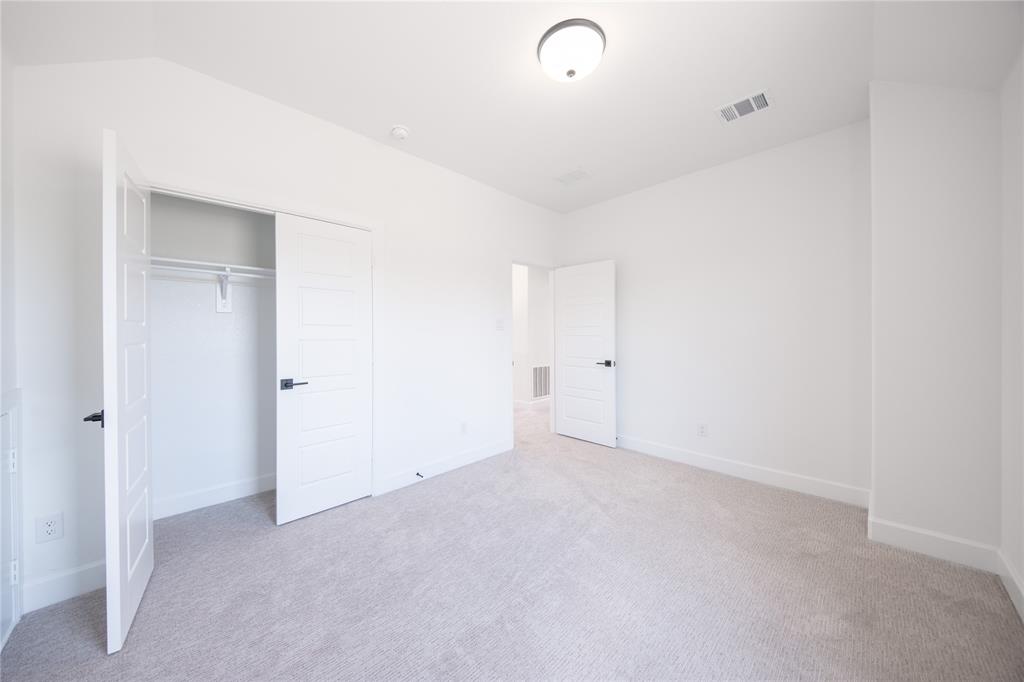 2719 Triumph Court Heath, TX 75126 - Photo 8 of 39 a view of an empty room