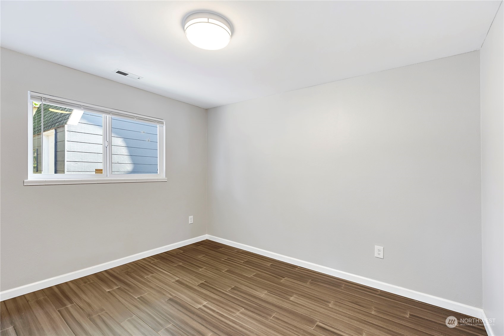 7209 6th Avenue West Everett, WA 98203 - Photo 23 of 27 wooden floor in an empty room with a window