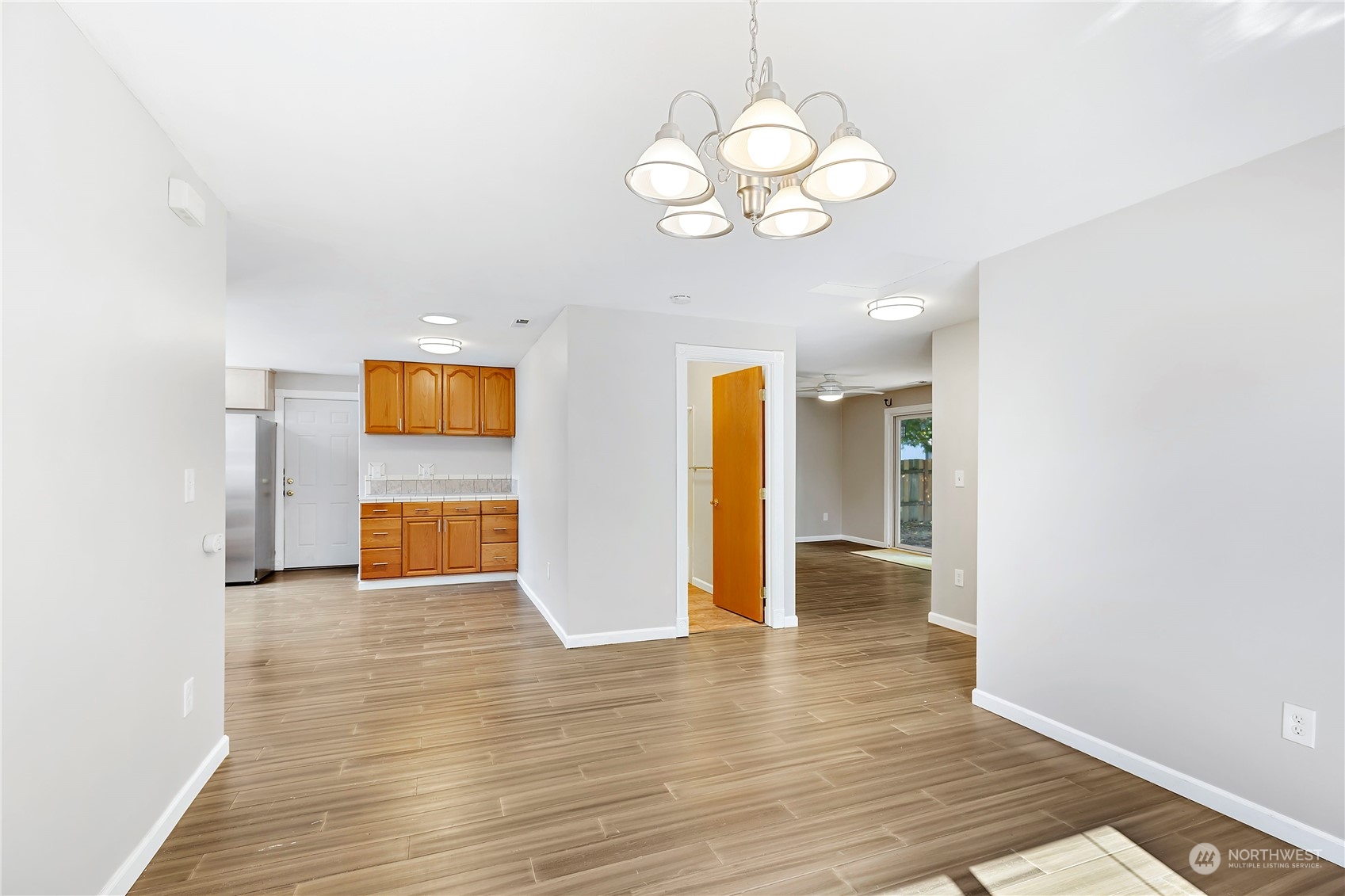7209 6th Avenue West Everett, WA 98203 - Photo 8 of 27 a view of an empty room with wooden floor and a window
