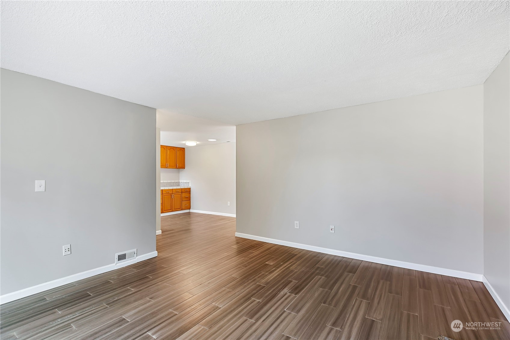 7209 6th Avenue West Everett, WA 98203 - Photo 10 of 27 a view of an empty room with wooden floor