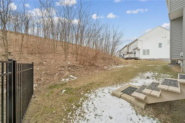 a view of a backyard of the house