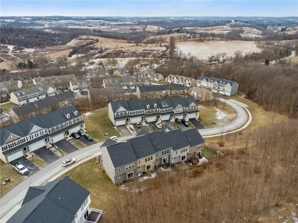 an aerial view of a house with a lake view