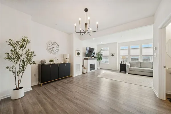 a view of a kitchen with furniture and a chandelier