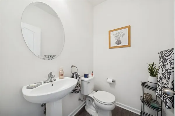 a bathroom with a sink a mirror and a toilet