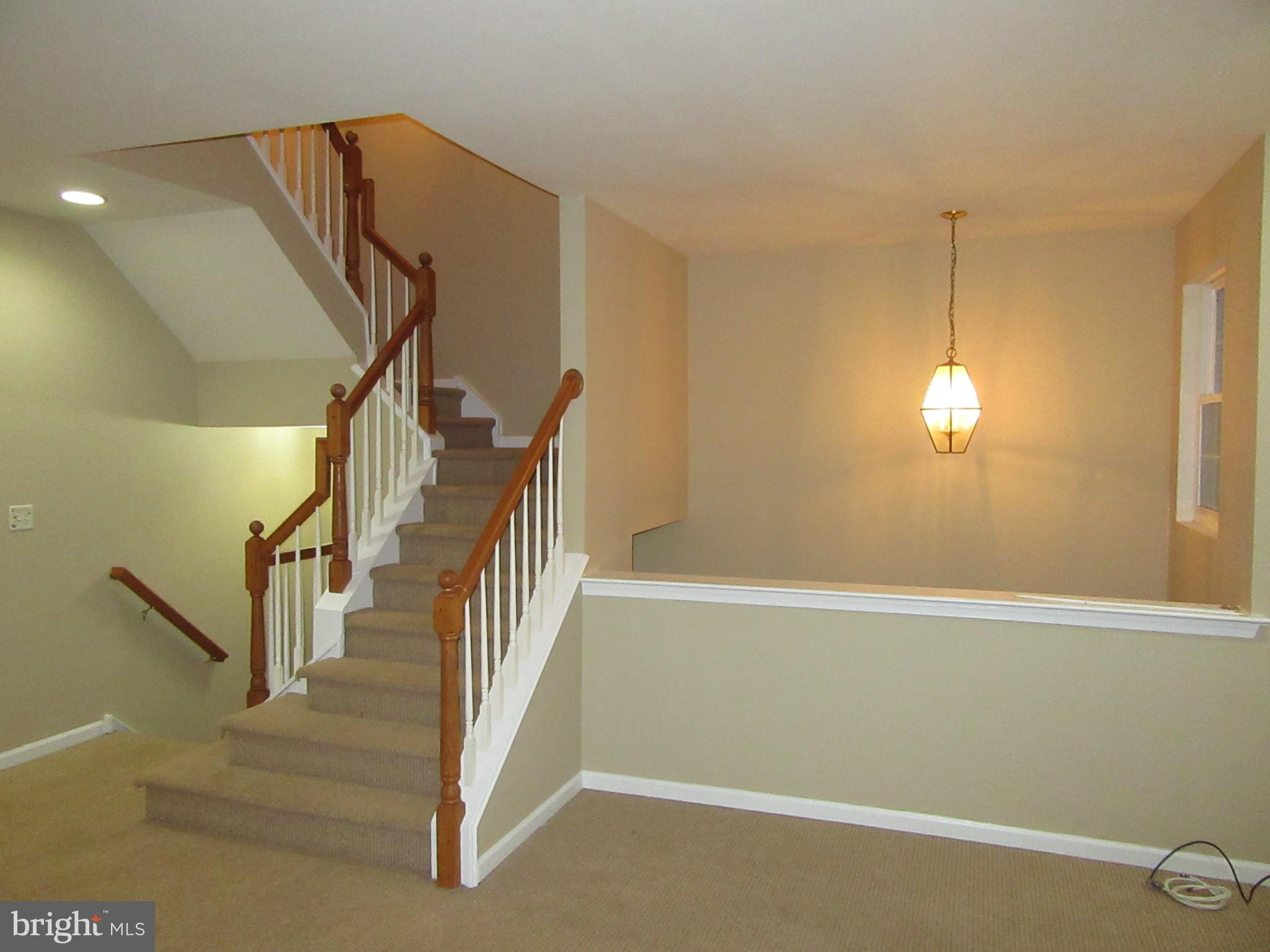 103 Persimmon Place Bear, DE 19701 - Photo 12 of 22 a view of a room with stairs and wooden floor
