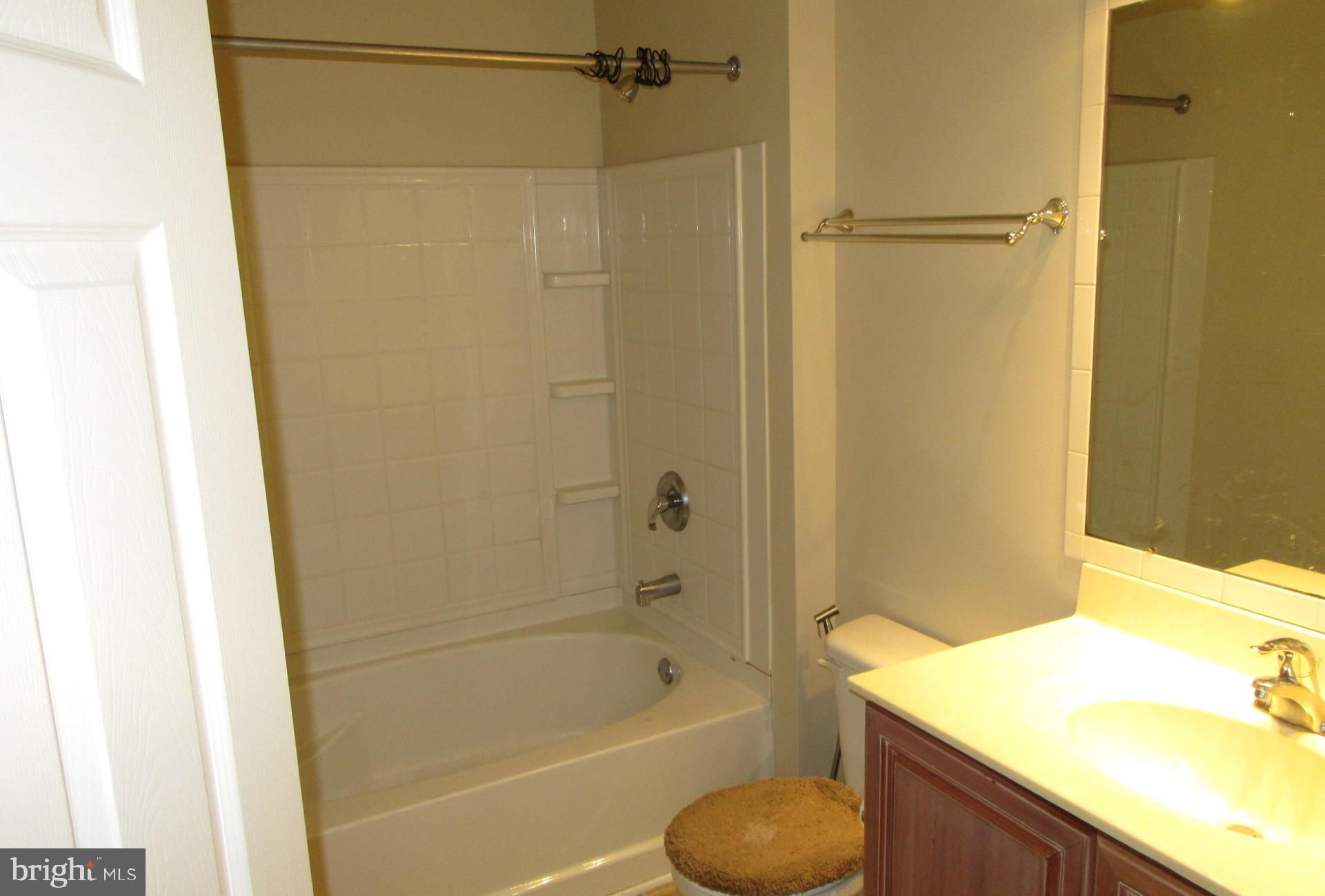 103 Persimmon Place Bear, DE 19701 - Photo 18 of 22 a bathroom with a granite countertop sink toilet and shower