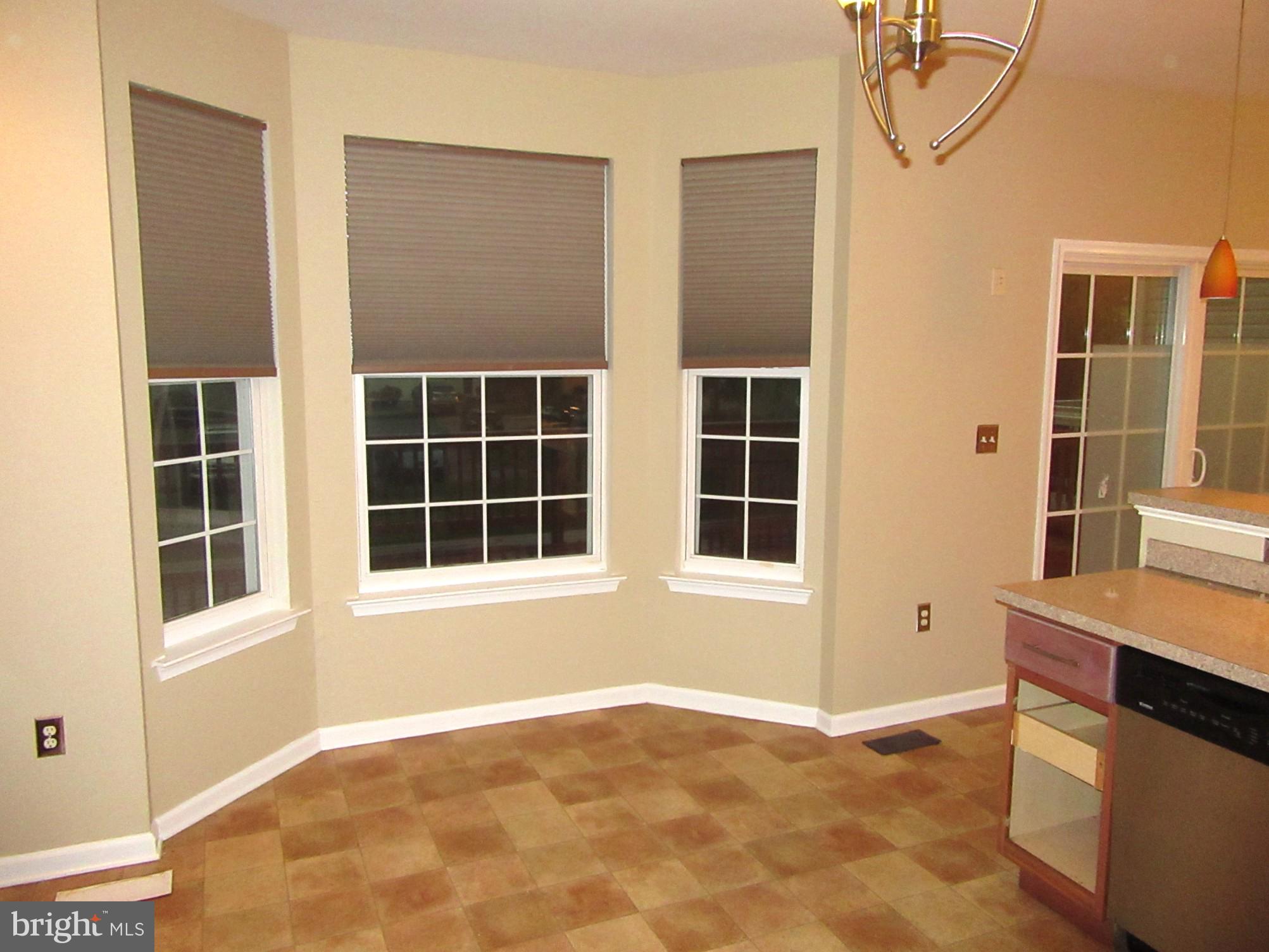 103 Persimmon Place Bear, DE 19701 - Photo 5 of 22 a view of an empty room with a window