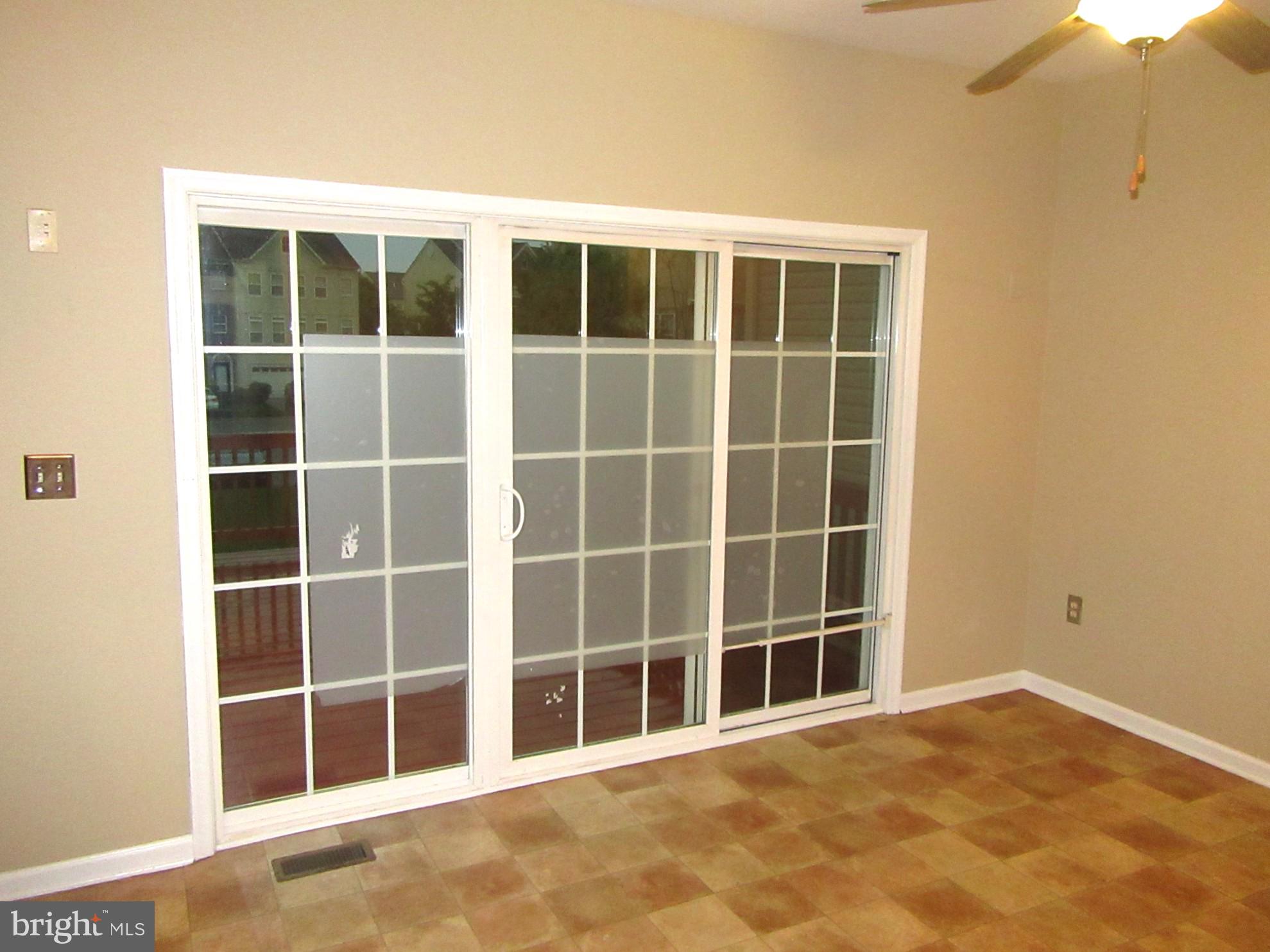 103 Persimmon Place Bear, DE 19701 - Photo 6 of 22 a view of an empty room with a window