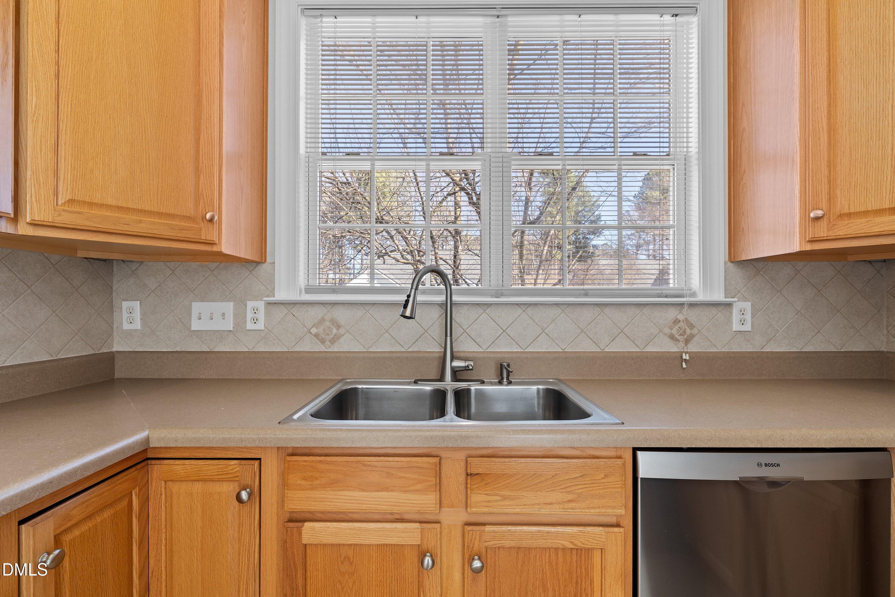 105 Rockport Ridge Way Cary, NC 27519 - Photo 8 of 43 a kitchen with a sink and cabinets
