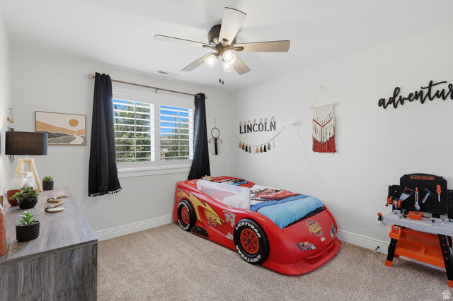 10676 Urban Rdg Cove South Jordan, UT 84095 - Photo 33 of 48 Bedroom featuring neutral carpeting, white walls, and a ceiling fan with integrated lighting
