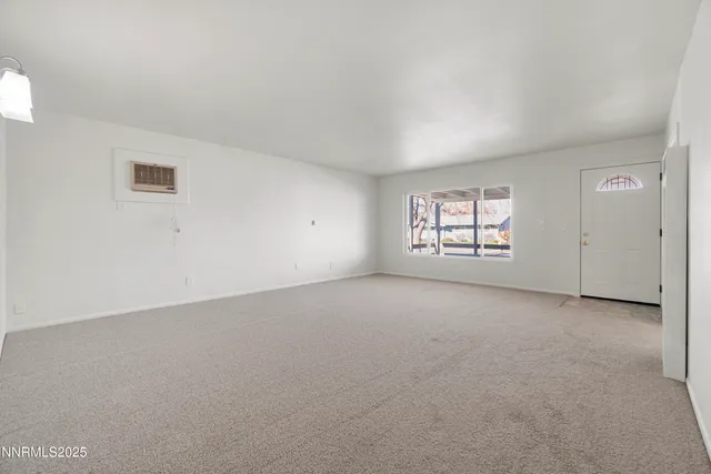 a view of a kitchen with stainless steel appliances granite countertop a stove top oven a sink and dishwasher