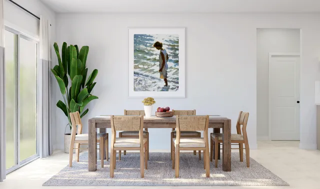 a dining room with furniture a potted plant and a painting