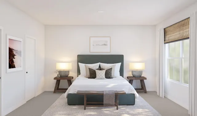 a bedroom with a bed and window