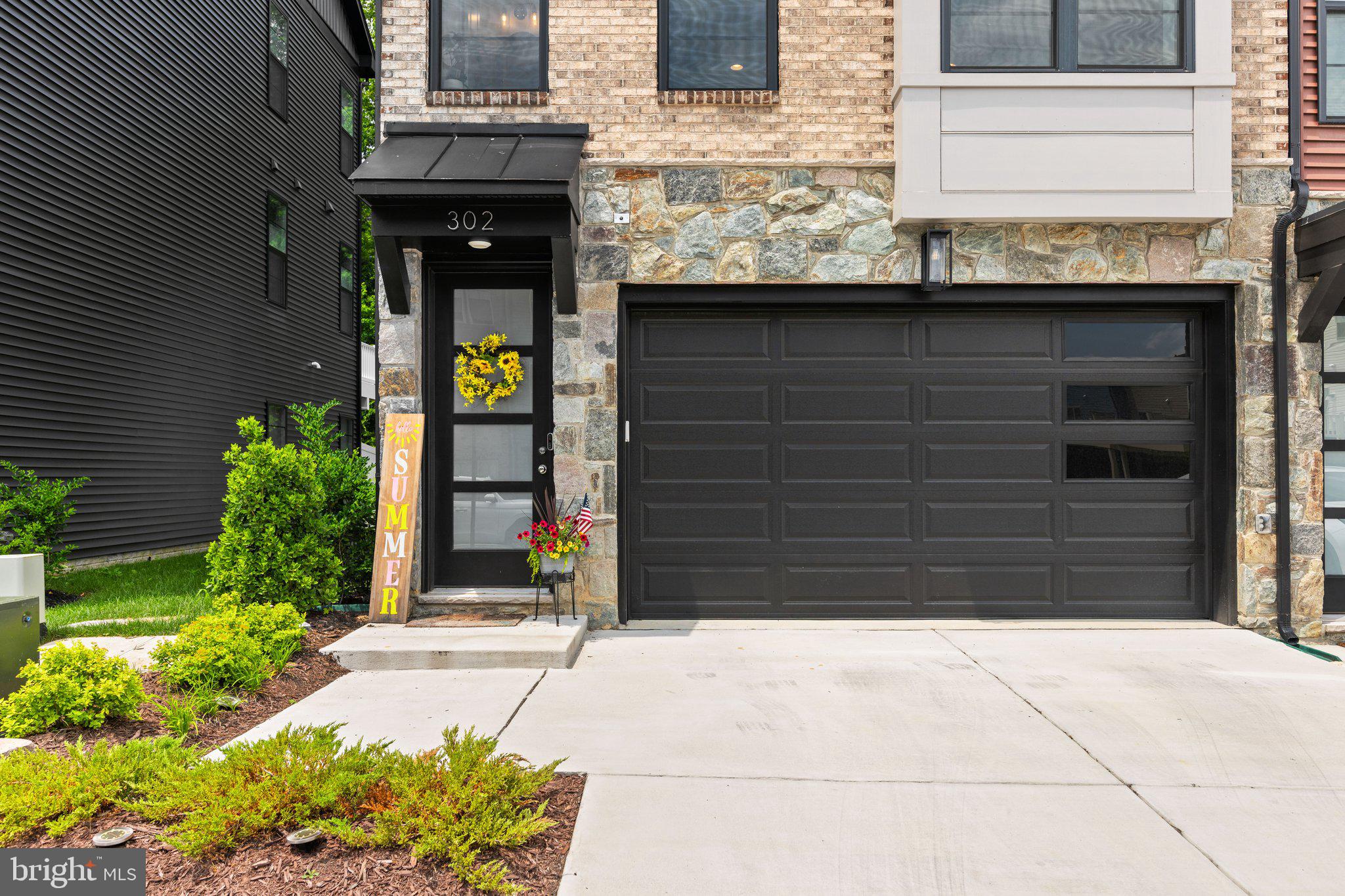 302 Alluvium Drive Laurel, MD 20724 - Photo 3 of 66 a couple of potted plants in front of door
