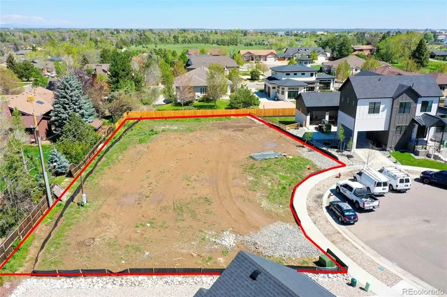 an aerial view of a house with a swimming pool