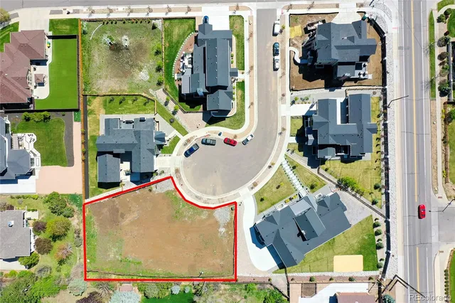 an aerial view of houses with an outdoor space