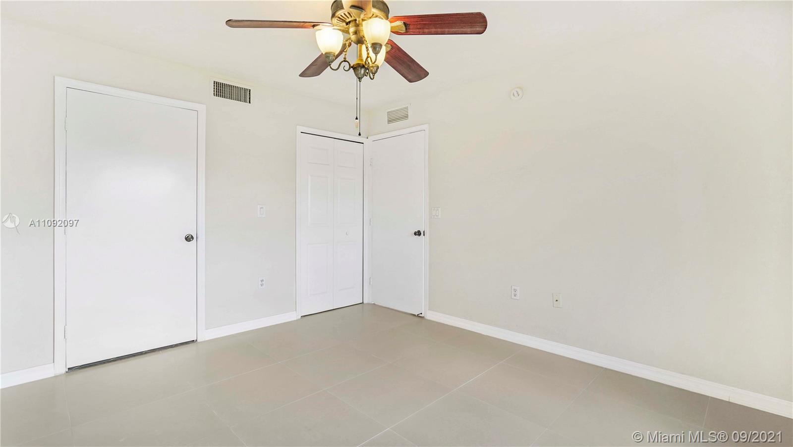 1270 Southeast 26th Street, Unit 101 Homestead, FL 33035 - Photo 5 of 12 a view of a small space with a fan
