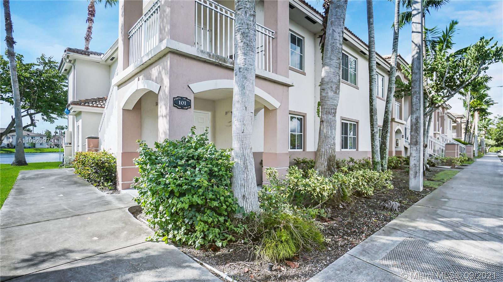 1270 Southeast 26th Street, Unit 101 Homestead, FL 33035 - Photo 9 of 12 a view of a building with a yard