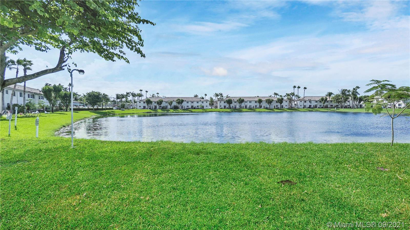 1270 Southeast 26th Street, Unit 101 Homestead, FL 33035 - Photo 10 of 12 a view of a lake with a big yard