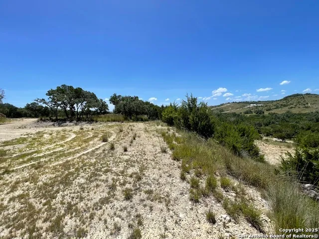 a view of a lake with a yard