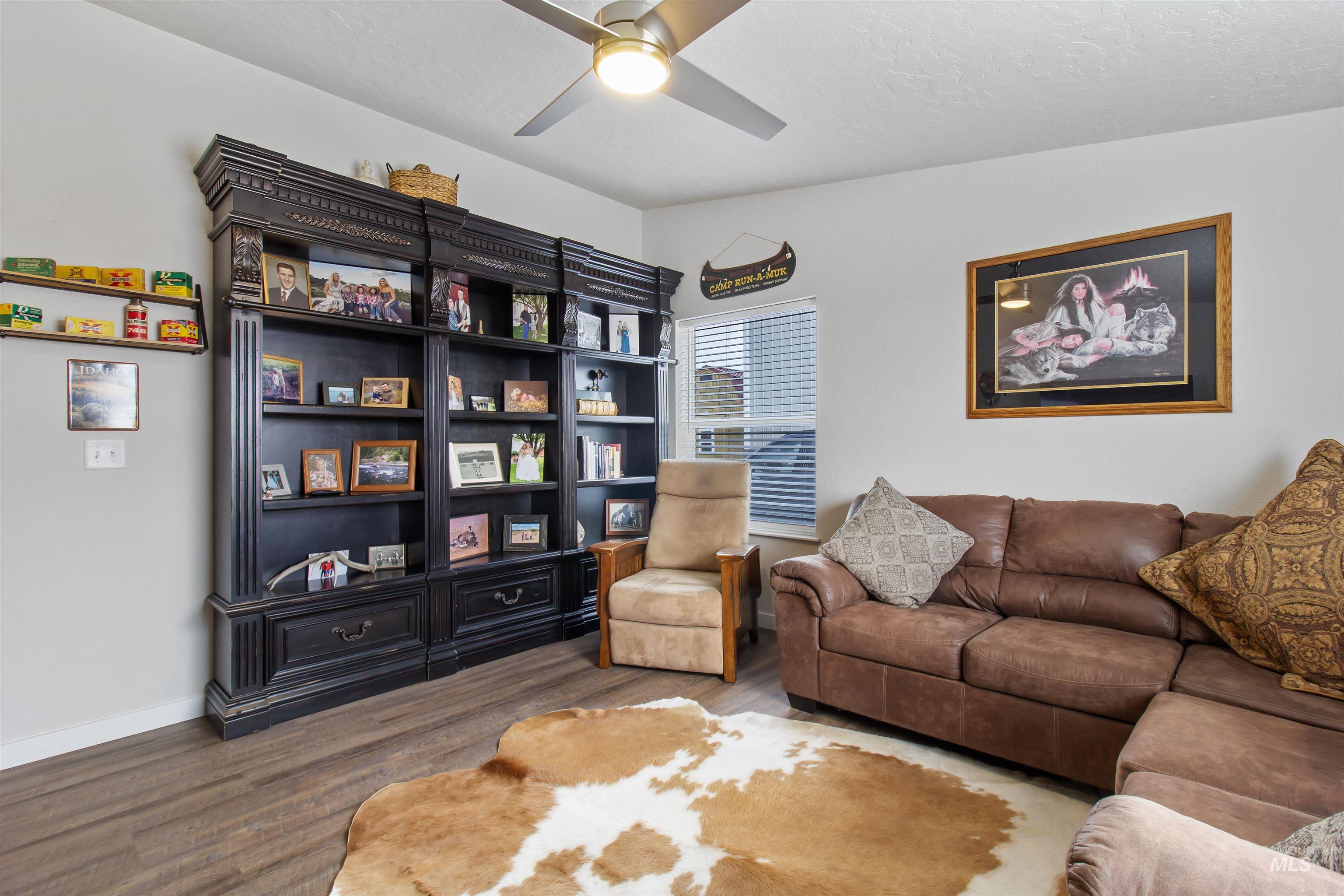 161 Horseshoe Loop West Fairfield, ID 83327 - Photo 11 of 50 Living area featuring wood finished floors and ceiling fan
