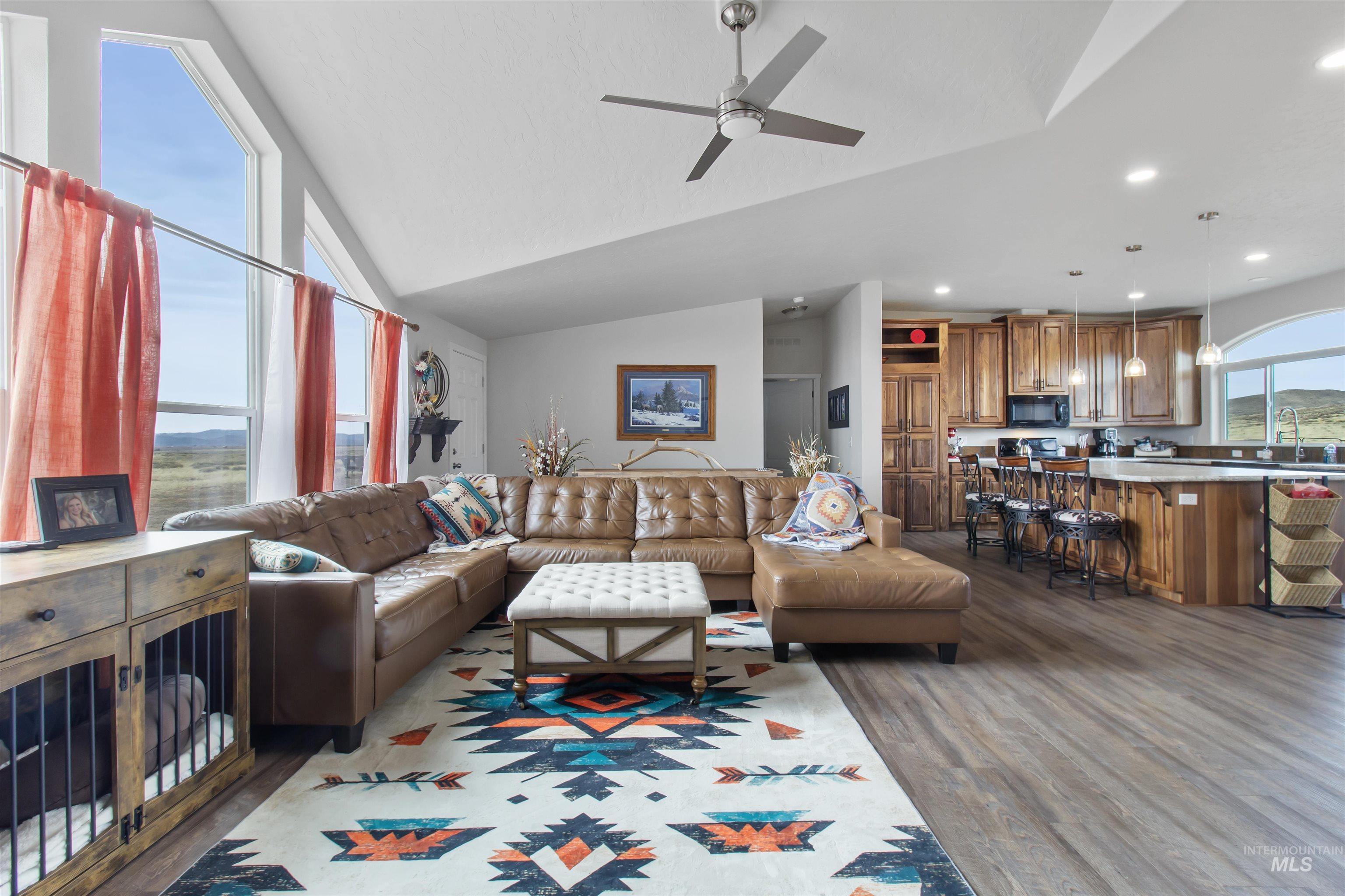 161 Horseshoe Loop West Fairfield, ID 83327 - Photo 26 of 50 Living area with vaulted ceiling, ceiling fan, dark wood-style floors, and recessed lighting