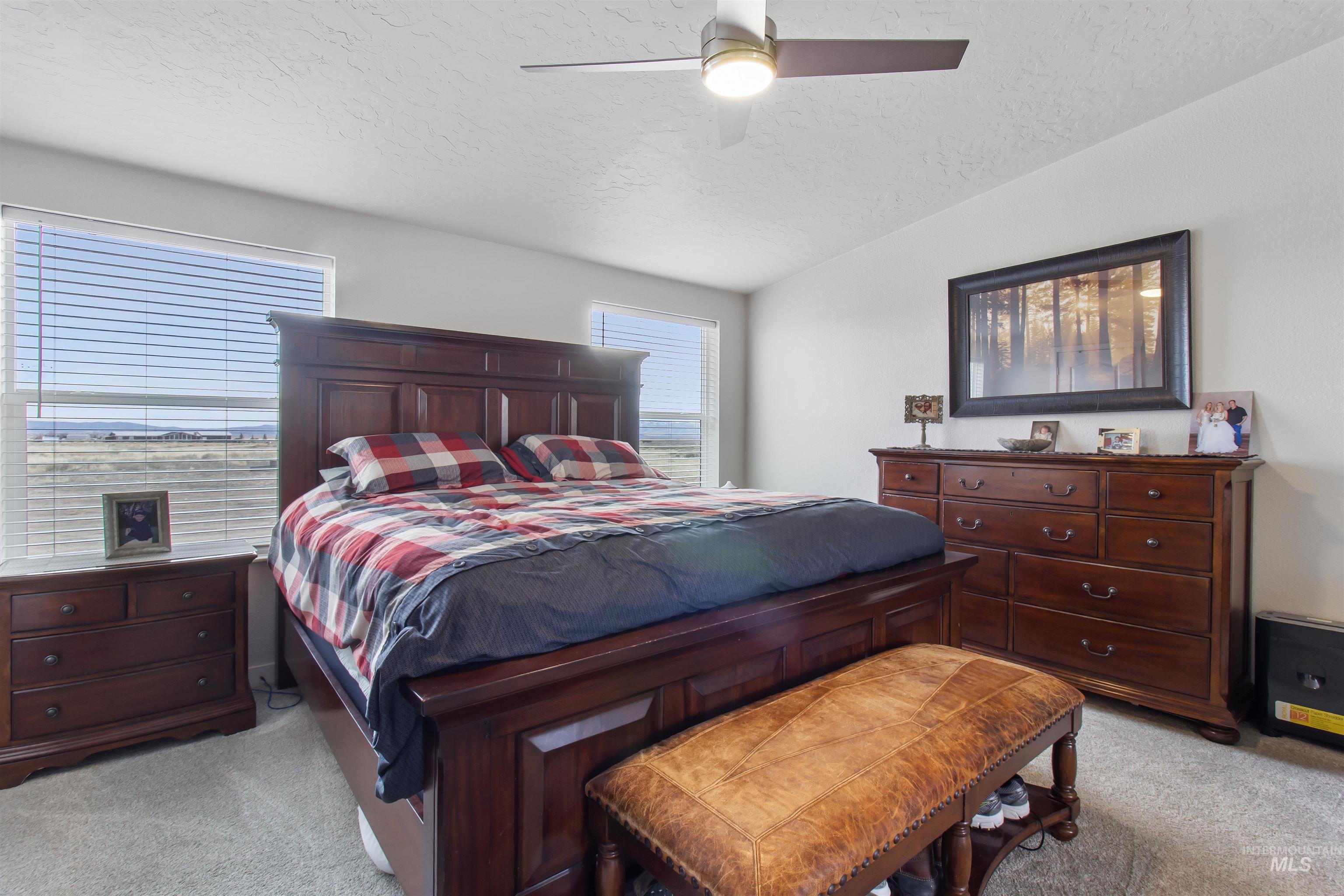 161 Horseshoe Loop West Fairfield, ID 83327 - Photo 29 of 50 Bedroom with light carpet and a ceiling fan