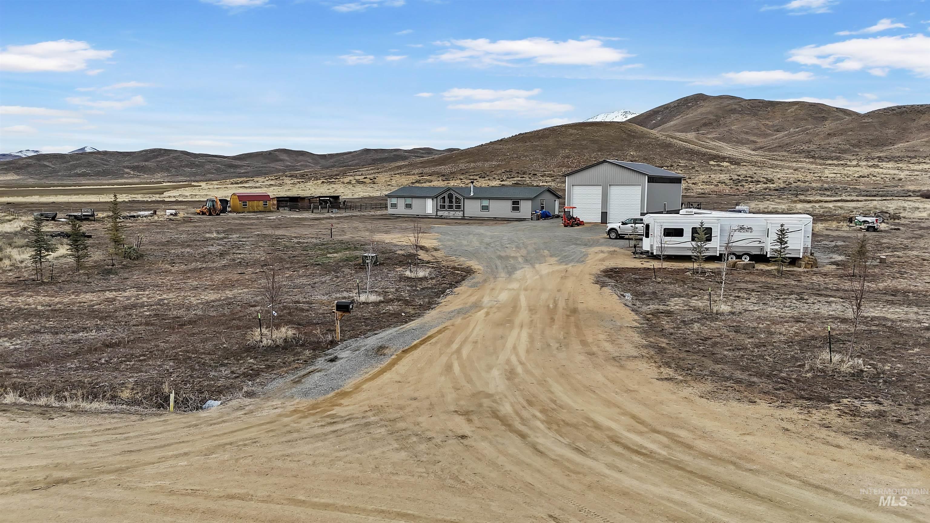161 Horseshoe Loop West Fairfield, ID 83327 - Photo 3 of 50 View of dirt / gravel driveway featuring a mountain view