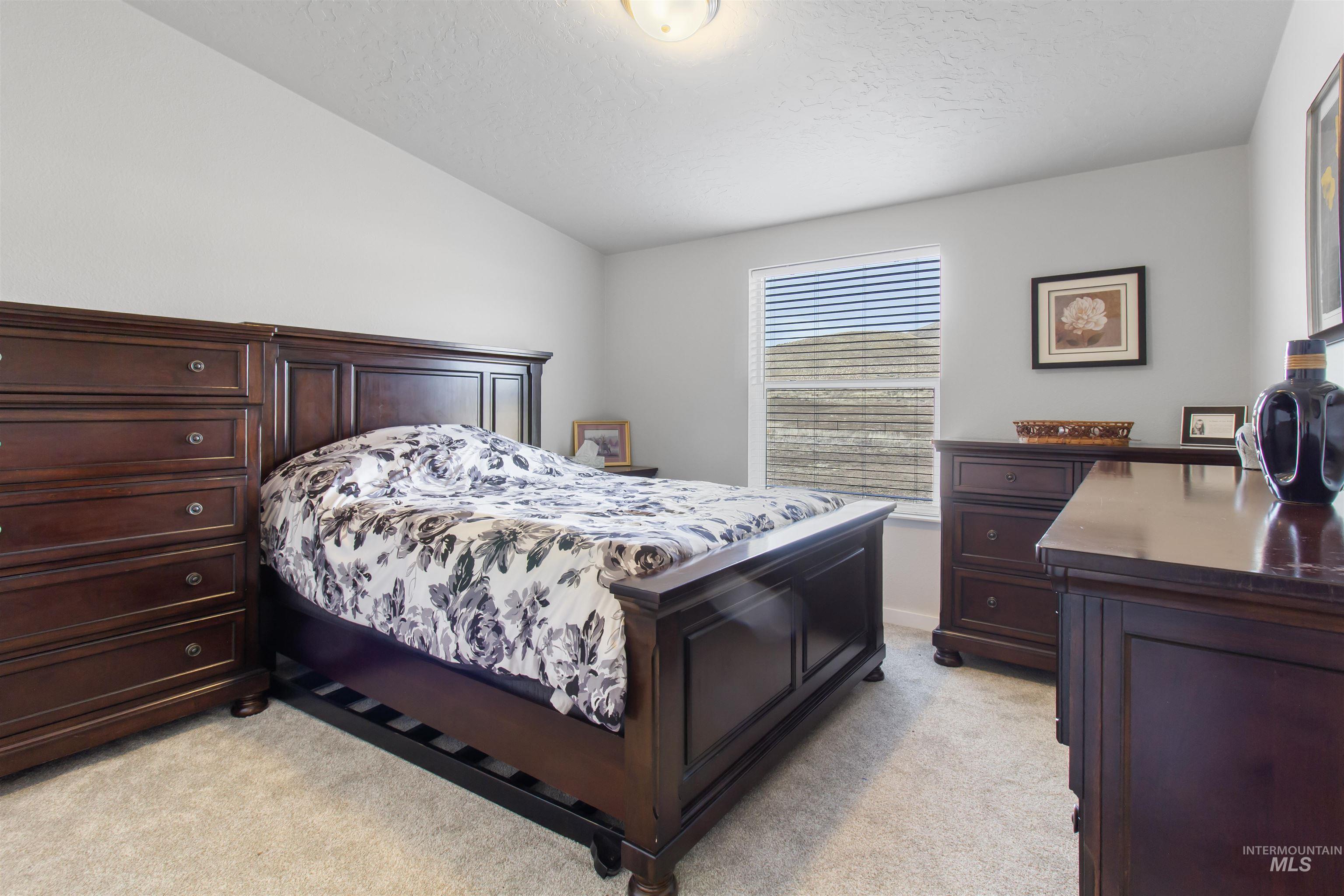 161 Horseshoe Loop West Fairfield, ID 83327 - Photo 34 of 50 Bedroom with light carpet and baseboards