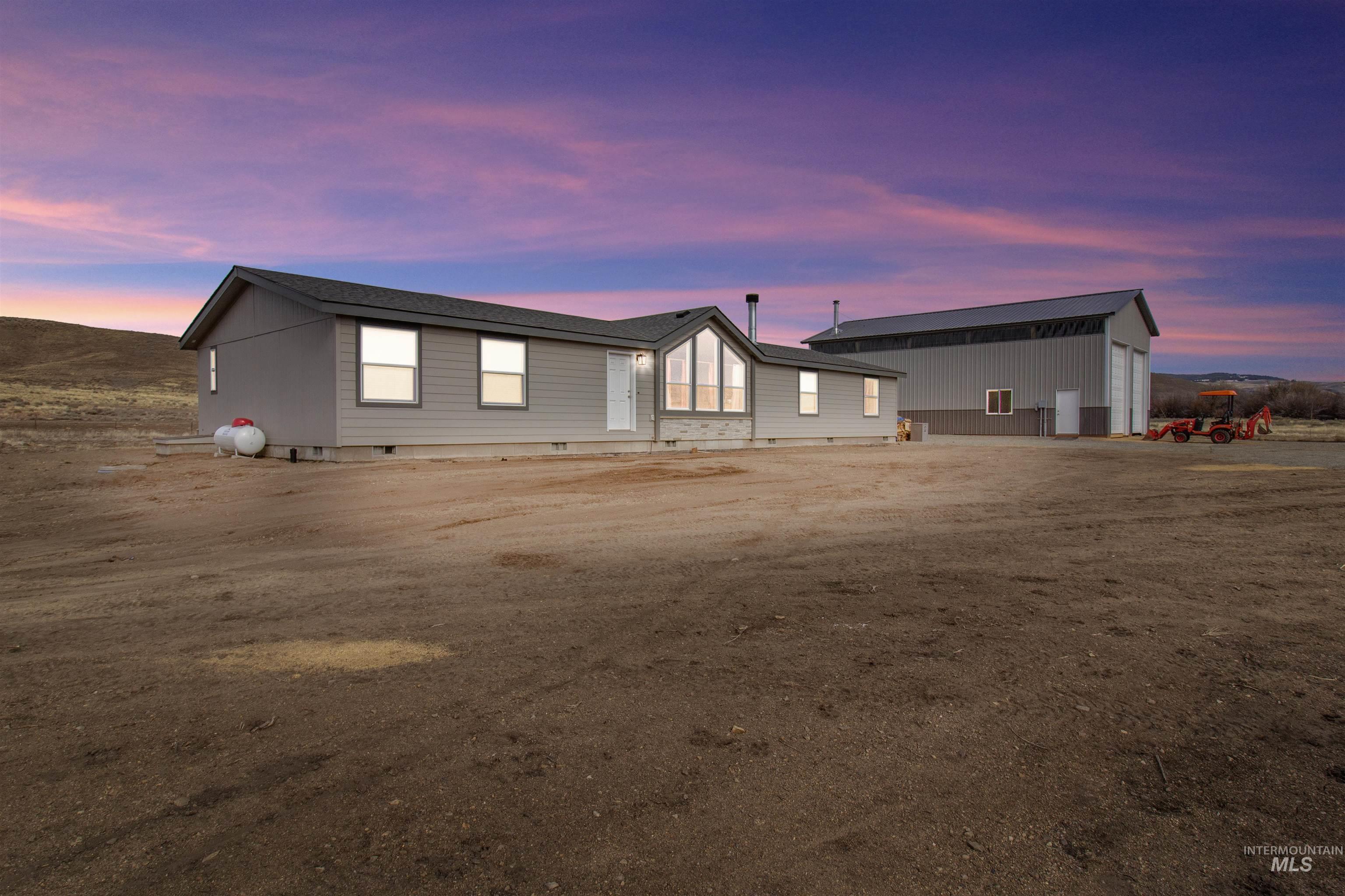 161 Horseshoe Loop West Fairfield, ID 83327 - Photo 50 of 50 Back of property with crawl space and an outbuilding