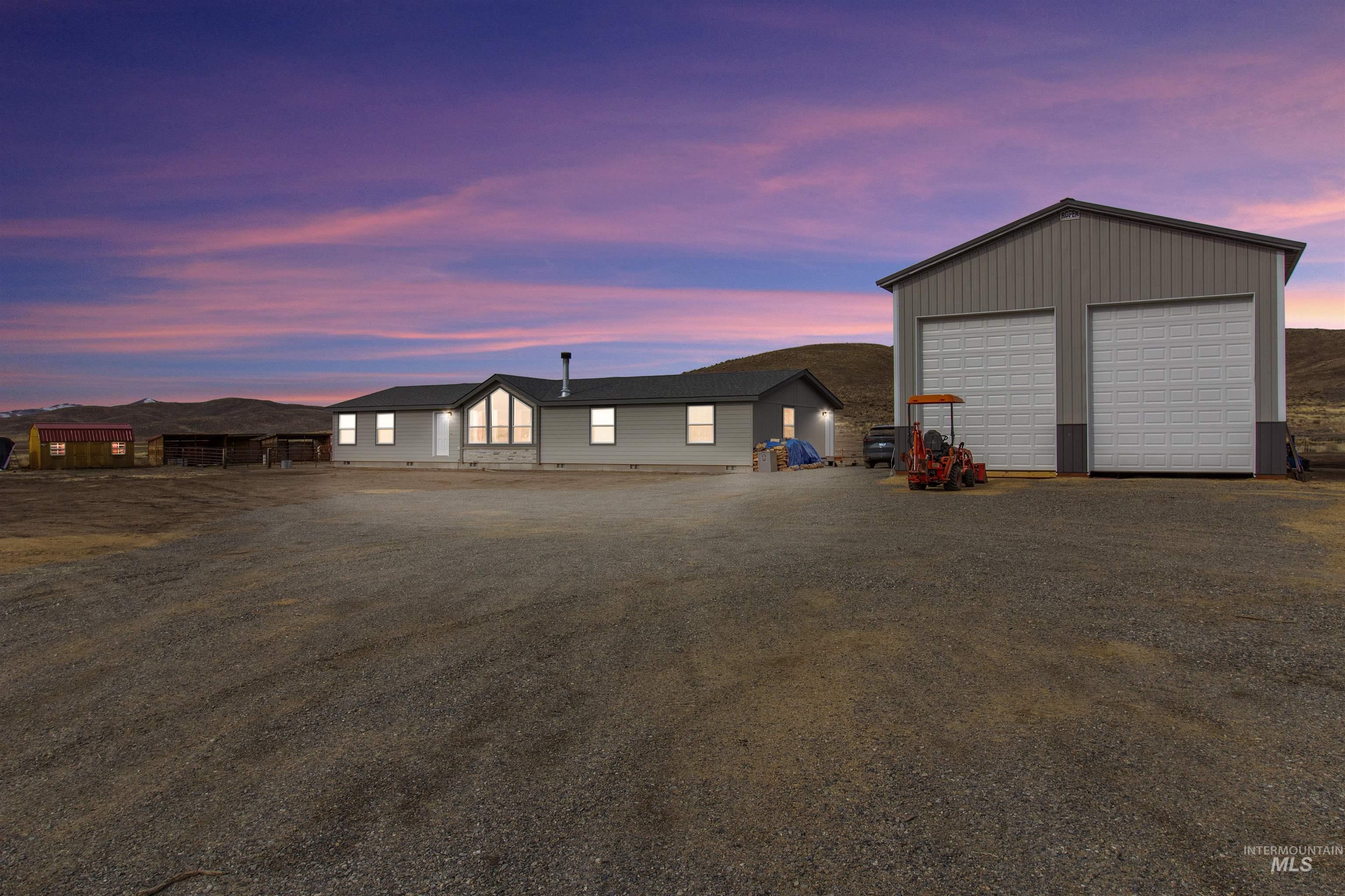 161 Horseshoe Loop West Fairfield, ID 83327 - Photo 7 of 50 View of front of property with an outbuilding and a detached garage
