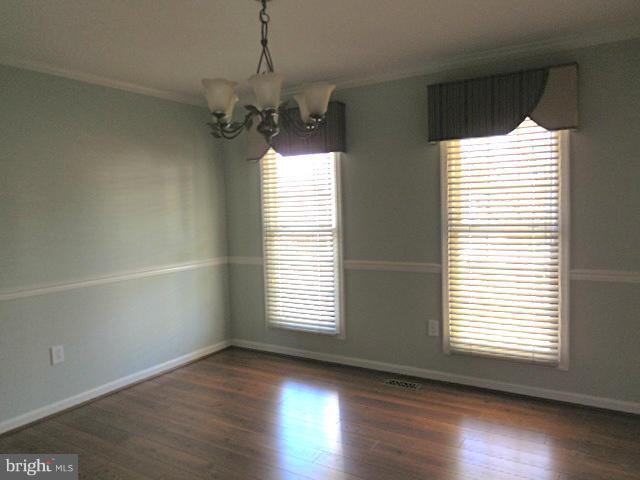 1751 Canal Run Drive Point of Rocks, MD 21777 - Photo 11 of 23 a view of an empty room with wooden floor and a window