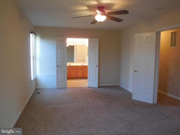 1751 Canal Run Drive Point of Rocks, MD 21777 - Photo 15 of 23 an empty room with windows and fan