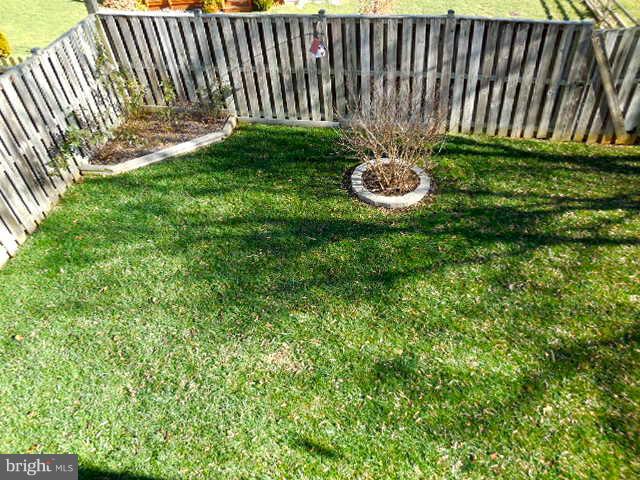 1751 Canal Run Drive Point of Rocks, MD 21777 - Photo 23 of 23 a view of a backyard with plants and a bench