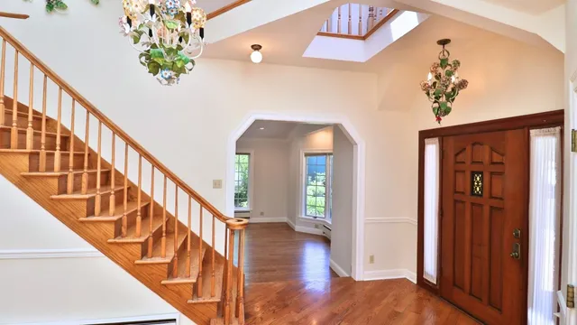 a view of entryway with wooden floor