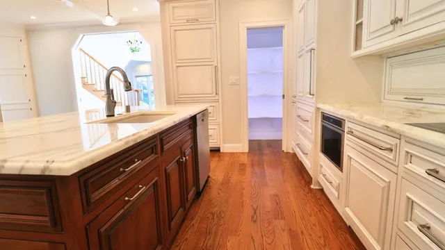 a kitchen with stainless steel appliances granite countertop a stove and a sink