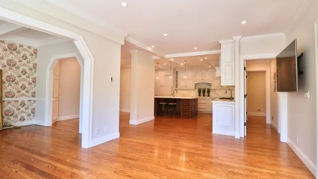 a view of kitchen with furniture and wooden floor