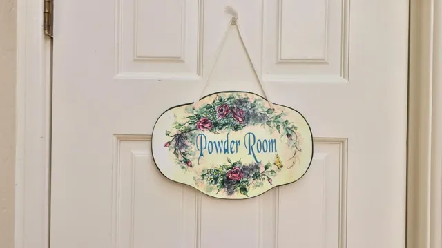a kitchen with stainless steel appliances white cabinets and a wooden floor