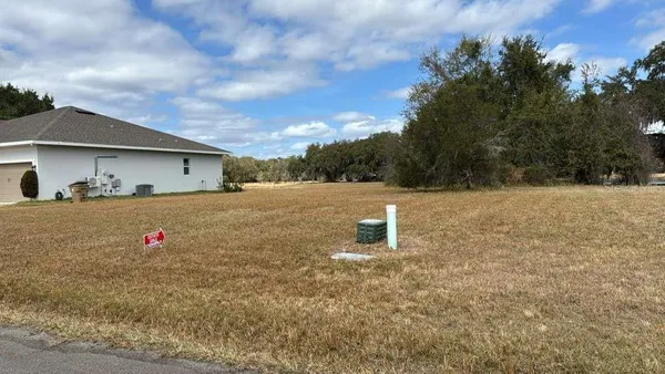 a view of swimming pool with an outdoor seating
